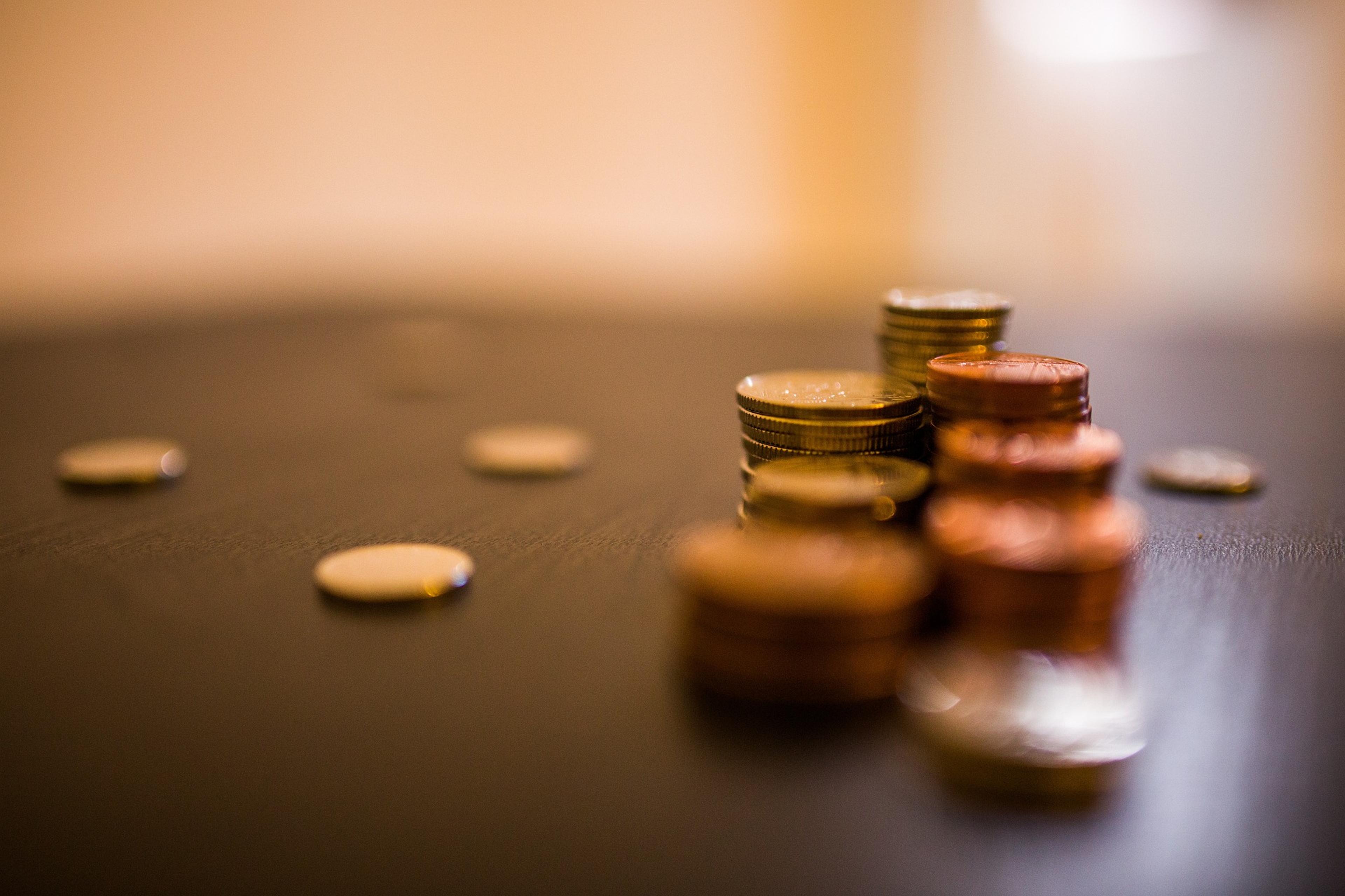 Coins placed on a wooden table